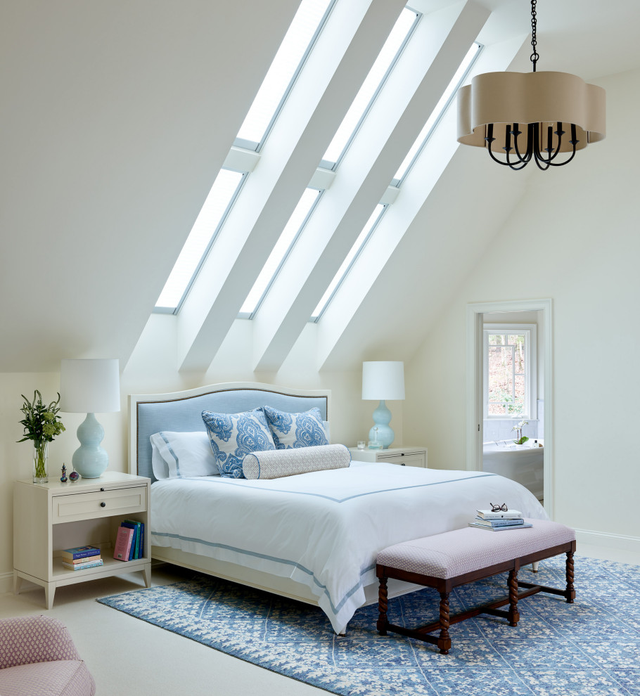 На фото: огромная хозяйская спальня в стиле неоклассика (современная классика) с белыми стенами, ковровым покрытием, стандартным камином, фасадом камина из камня и белым полом