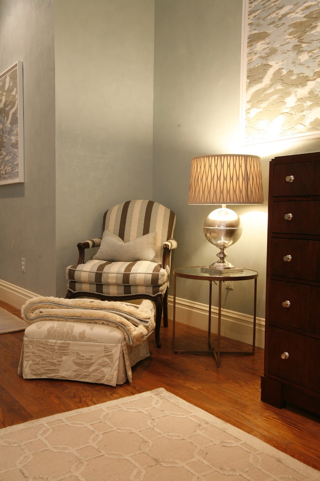 Inspiration for a large transitional master medium tone wood floor bedroom remodel in Boston with blue walls