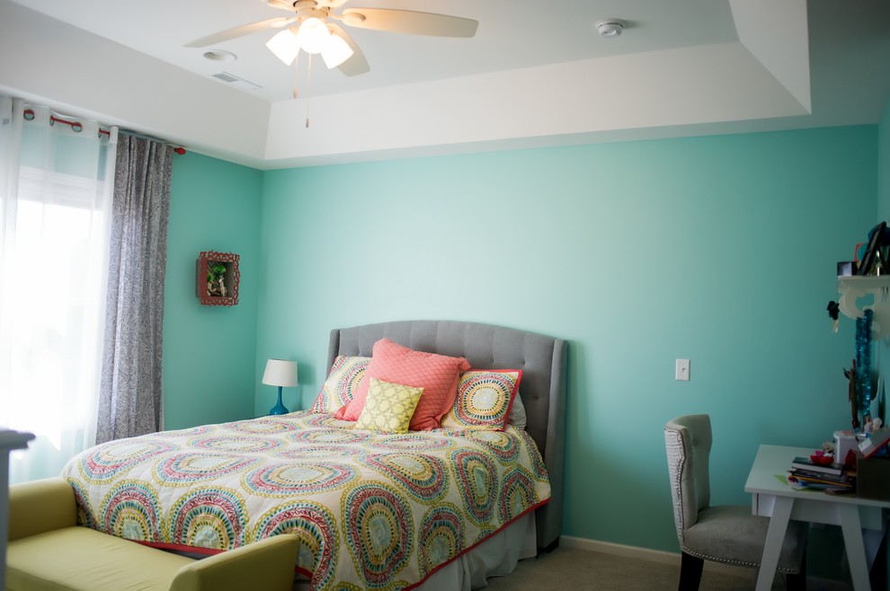 This is an example of a medium sized eclectic guest bedroom in Other with blue walls, carpet and no fireplace.