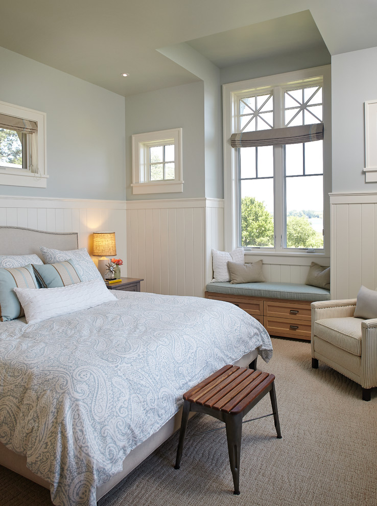 Beach style carpeted bedroom photo in Grand Rapids with blue walls