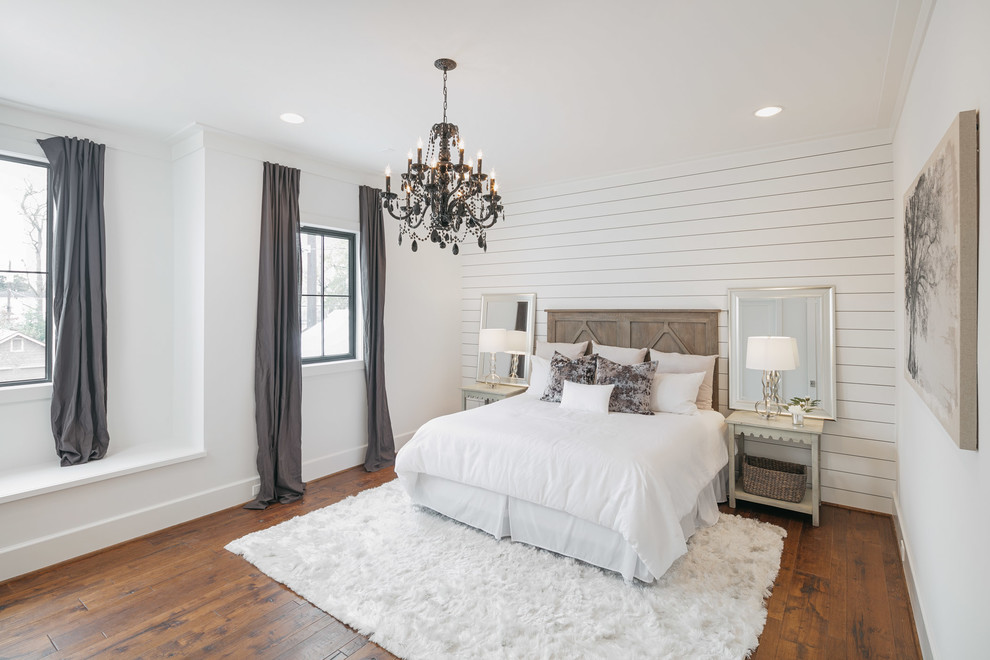 Example of a huge cottage master medium tone wood floor and brown floor bedroom design in Houston with white walls and no fireplace