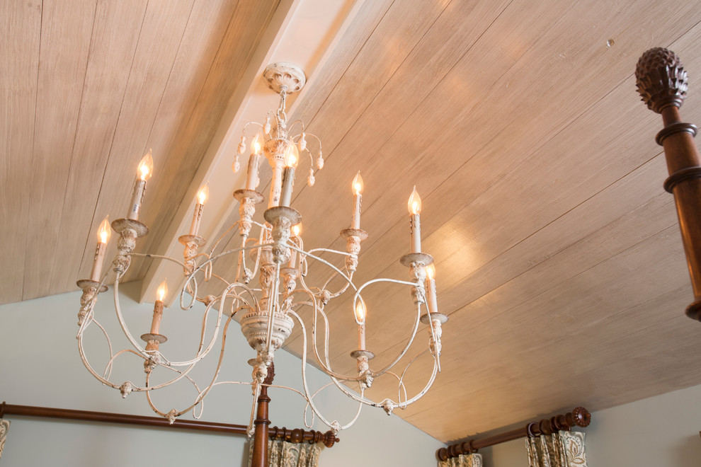 Expansive classic master bedroom in Houston with a wood ceiling.