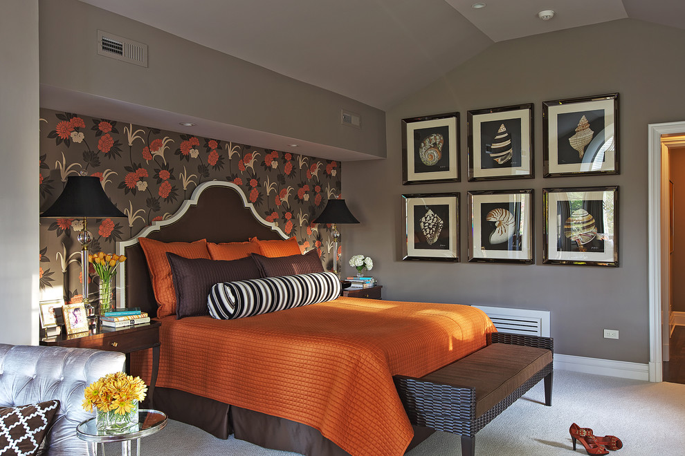 This is an example of a classic grey and brown and grey and silver bedroom in New York with grey walls, carpet and a feature wall.