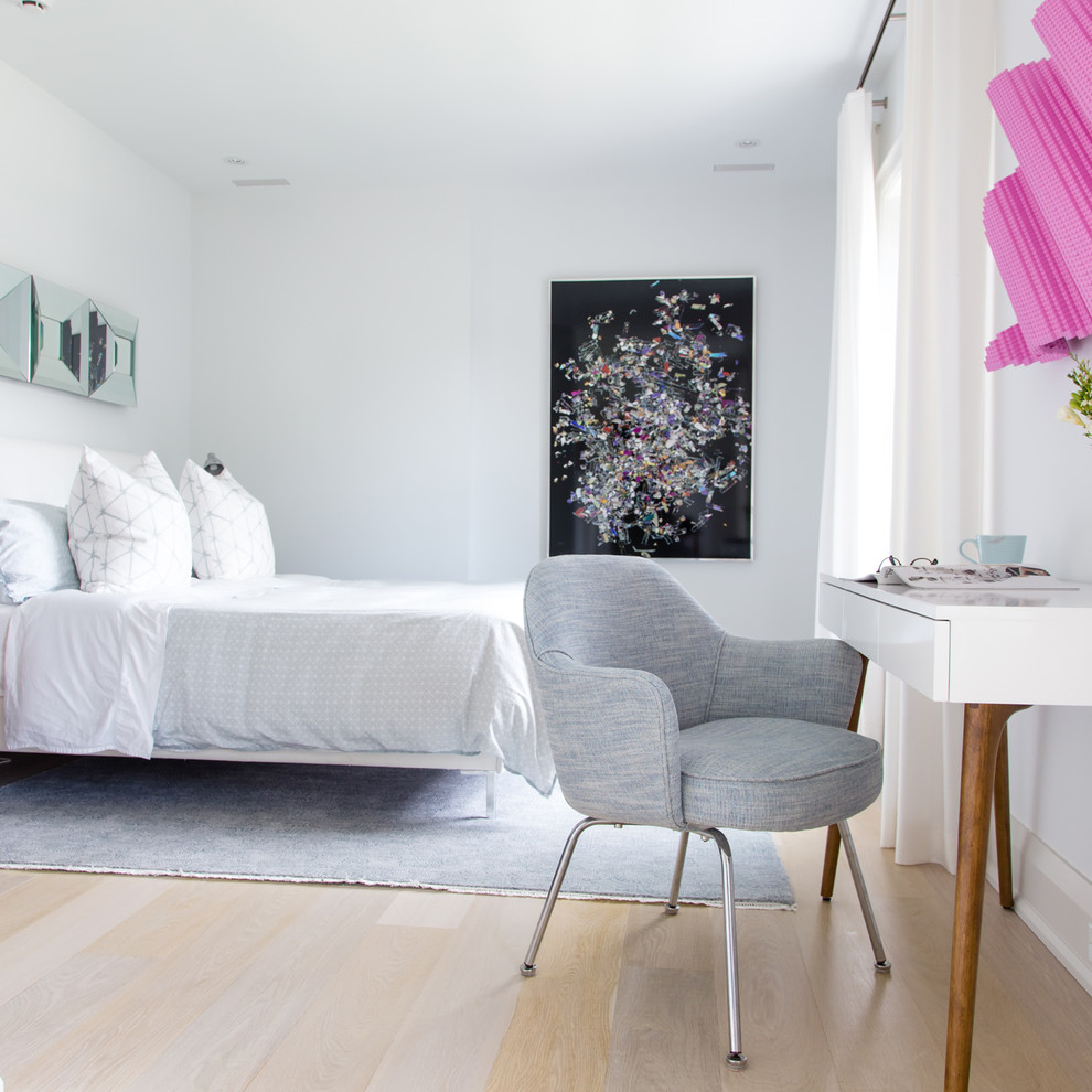 Inspiration for a contemporary guest light wood floor and beige floor bedroom remodel in Toronto with white walls