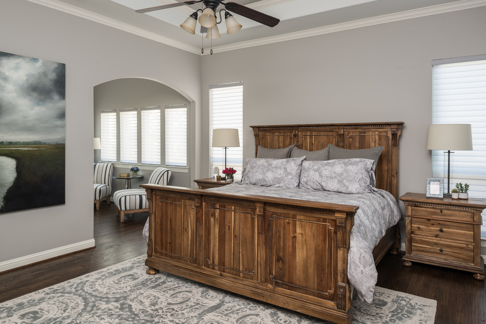 Design ideas for a large rural master bedroom in Dallas with grey walls, dark hardwood flooring and brown floors.