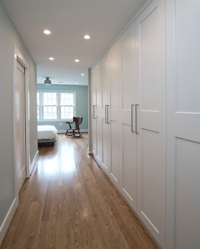 Large transitional master medium tone wood floor and brown floor bedroom photo in DC Metro with gray walls and no fireplace