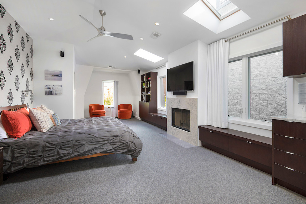 Contemporary master bedroom in Chicago with white walls, carpet, a standard fireplace and a tiled fireplace surround.