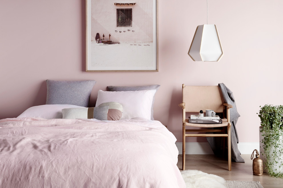 Example of a trendy bedroom design in Melbourne with pink walls