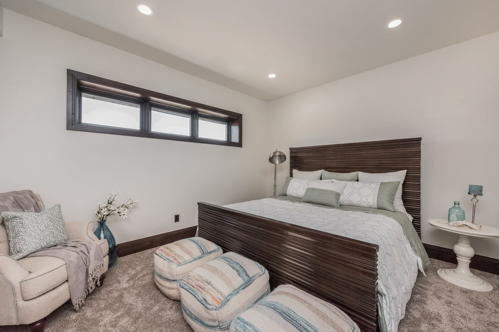 Photo of a medium sized victorian guest bedroom in Salt Lake City with beige walls, carpet, no fireplace and brown floors.
