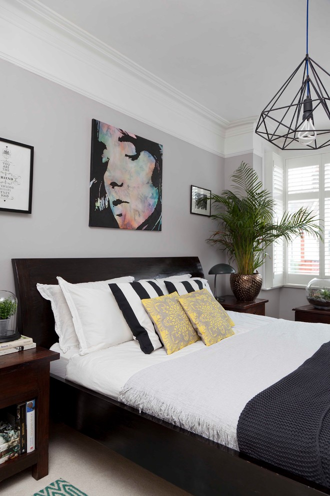 Example of a mid-sized transitional guest carpeted and white floor bedroom design in London with gray walls