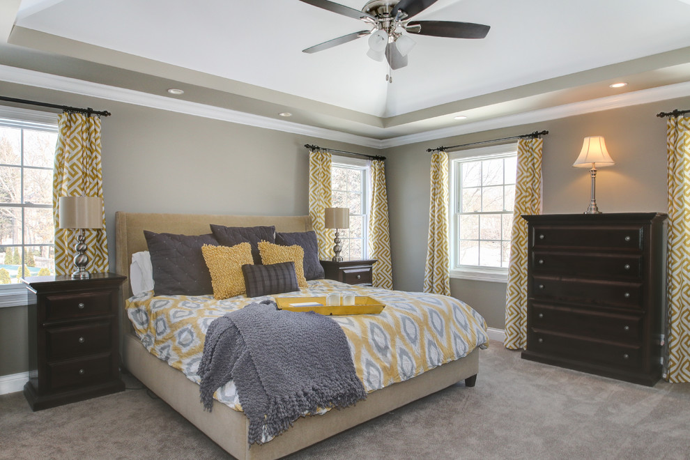Design ideas for a traditional grey and yellow bedroom in Chicago.