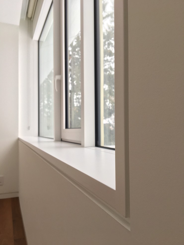 Example of a minimalist bedroom design in Toronto
