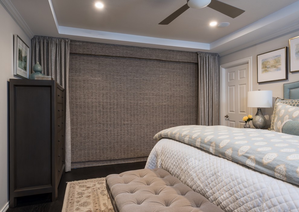 Inspiration for a mid-sized transitional master dark wood floor and brown floor bedroom remodel in Dallas with beige walls