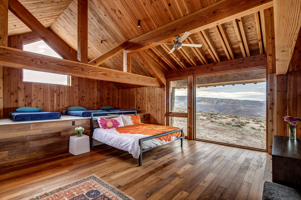 Inspiration for a rustic guest bedroom in Los Angeles with medium hardwood flooring.