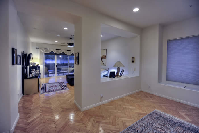 Inspiration for an expansive contemporary bedroom in Phoenix with medium hardwood flooring.
