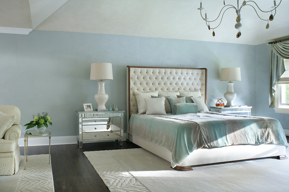 Inspiration for a large classic master bedroom in New York with blue walls, dark hardwood flooring and no fireplace.