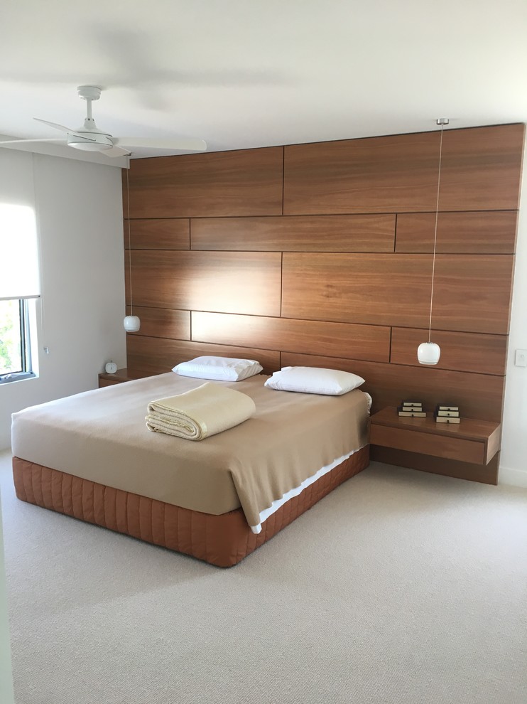 Large trendy master carpeted and beige floor bedroom photo in Gold Coast - Tweed with white walls