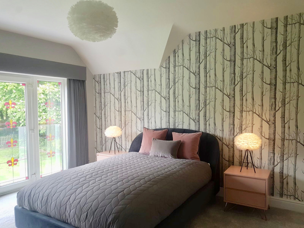This is an example of a large scandi guest and grey and pink bedroom in Hertfordshire with grey walls, carpet and grey floors.