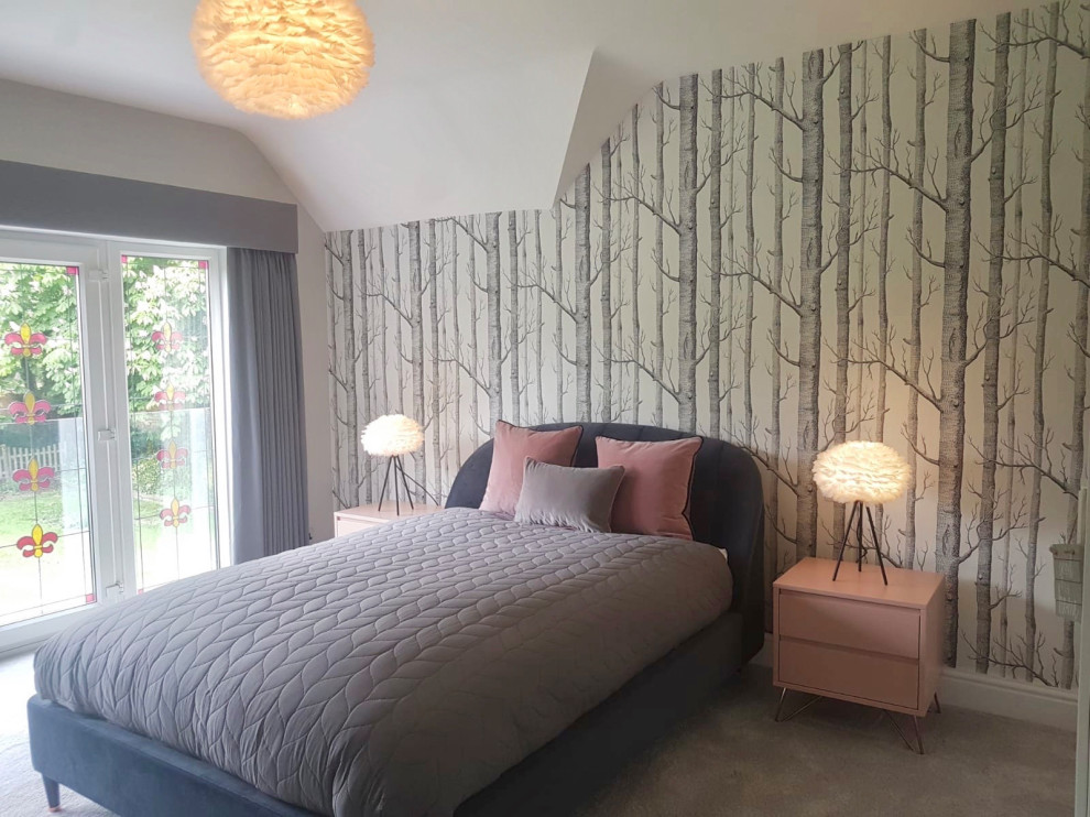 This is an example of a large scandinavian guest and grey and pink bedroom in Hertfordshire with grey walls, carpet and grey floors.