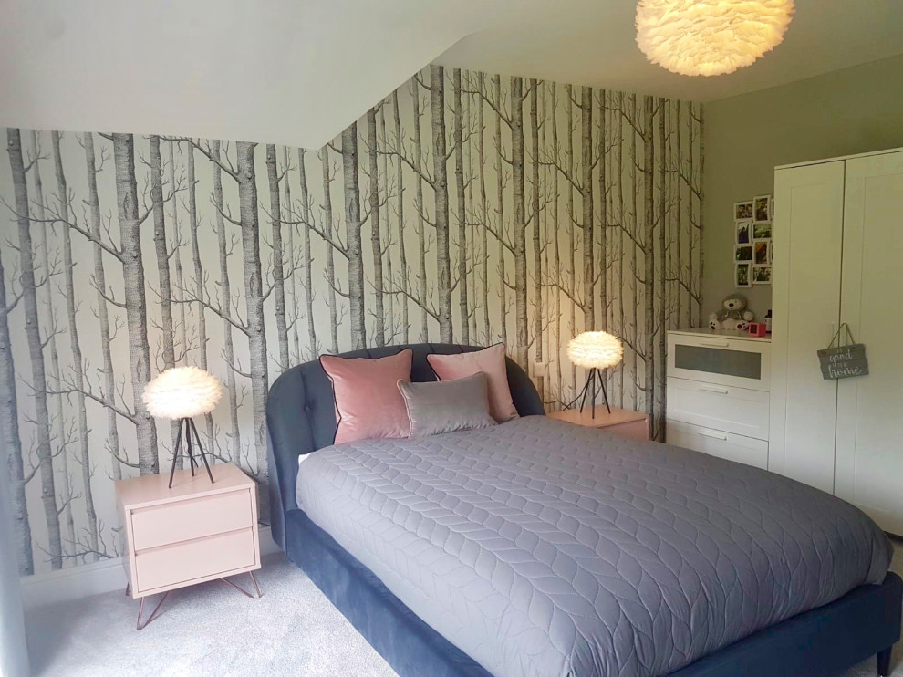 This is an example of a large scandinavian guest and grey and pink bedroom in Hertfordshire with grey walls, carpet and grey floors.