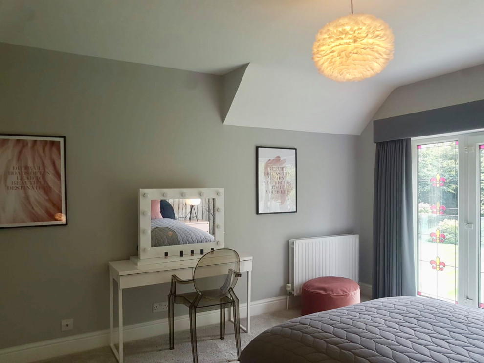 Photo of a large scandi guest and grey and pink bedroom in Hertfordshire with grey walls, carpet and grey floors.
