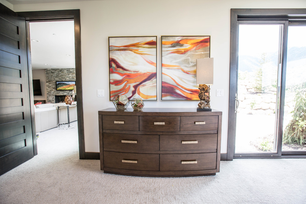Photo of a large contemporary guest bedroom in Salt Lake City with beige walls, no fireplace, carpet and grey floors.