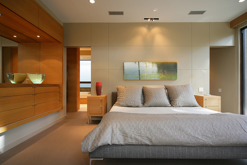 Design ideas for a contemporary bedroom in Dallas with beige walls and carpet.
