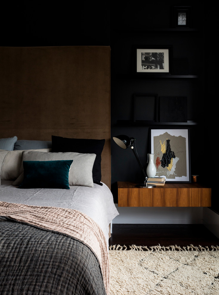 Photo of a medium sized contemporary master bedroom in London with black walls.