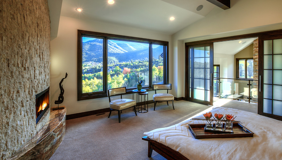 Huge master bedroom photo in Salt Lake City with white walls, a standard fireplace and a stone fireplace