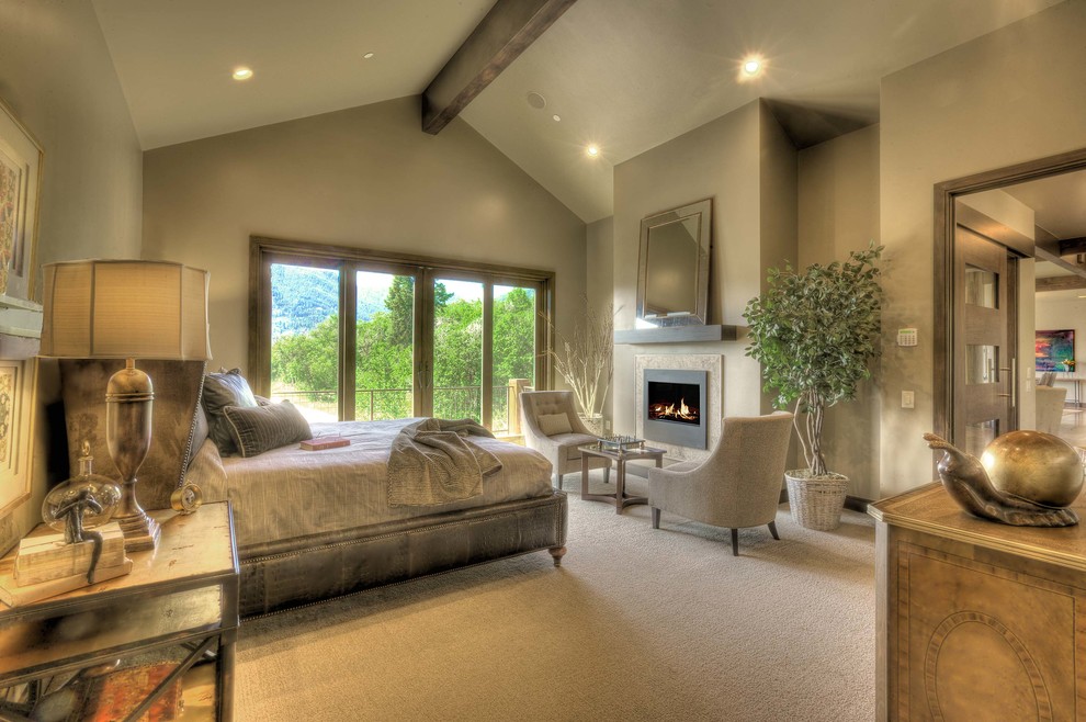 Expansive classic master and grey and cream bedroom in Salt Lake City with beige walls, carpet and a standard fireplace.
