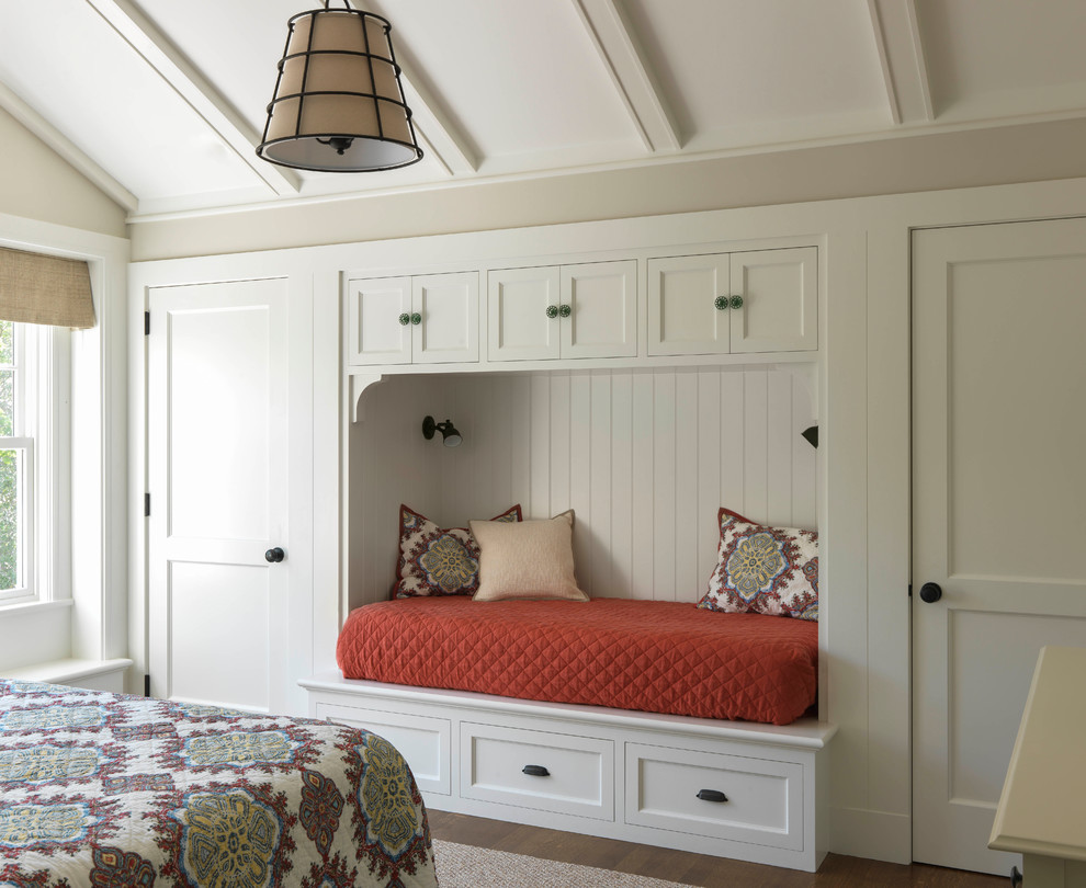 Inspiration for a mid-sized coastal guest dark wood floor and brown floor bedroom remodel in Other with beige walls