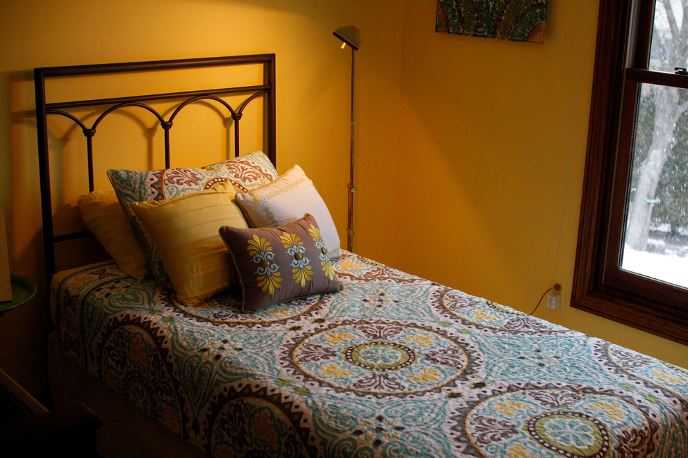 Inspiration for a medium sized classic guest bedroom in Detroit with yellow walls and carpet.
