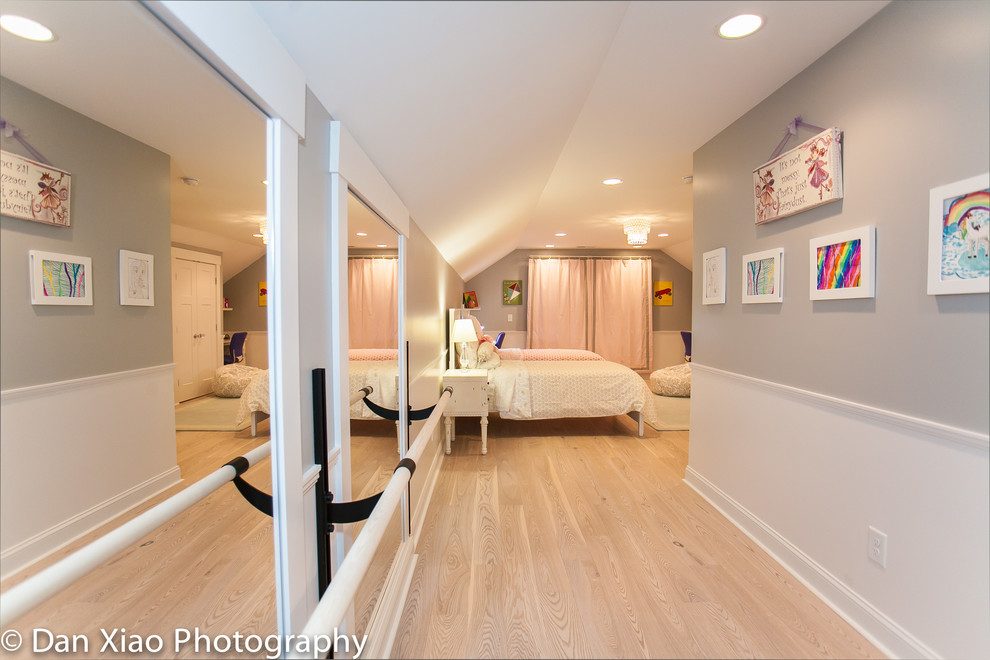 Example of a mid-sized arts and crafts light wood floor bedroom design in Raleigh with gray walls