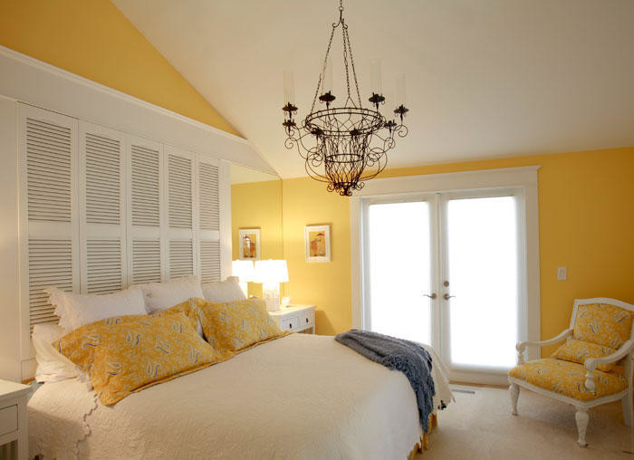 Example of a mid-sized transitional master carpeted and gray floor bedroom design in Seattle with yellow walls and no fireplace
