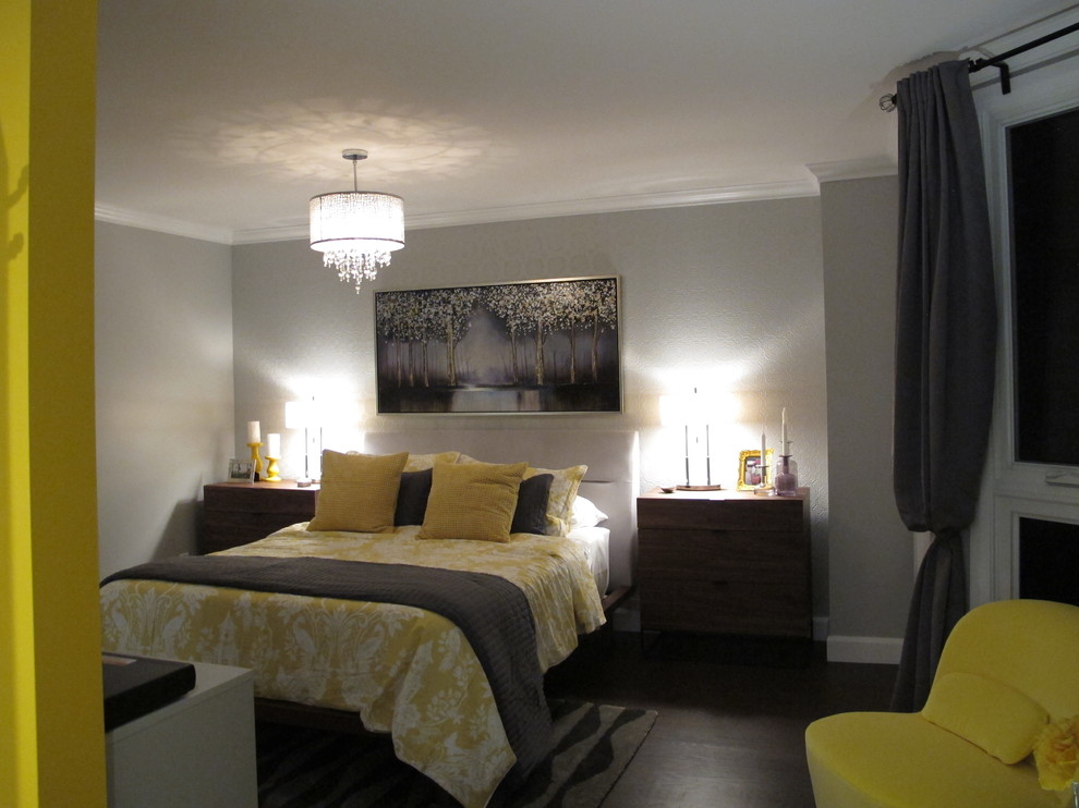 Example of a large trendy master dark wood floor and brown floor bedroom design in Montreal with yellow walls