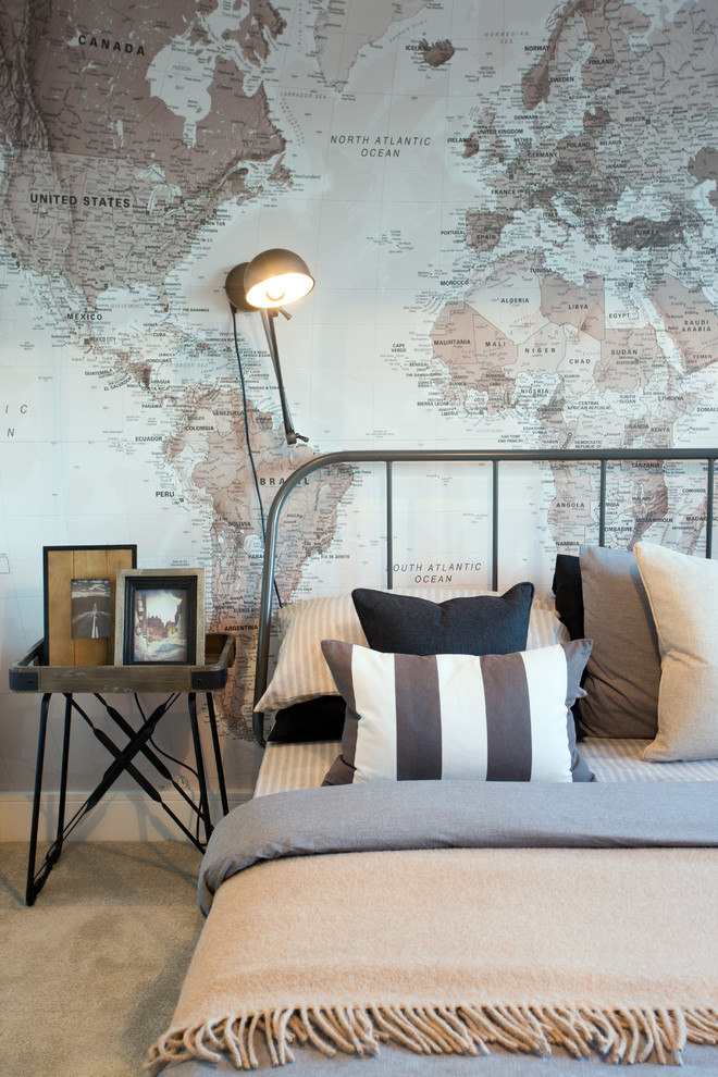 Inspiration for an industrial guest bedroom in Manchester with carpet and beige floors.