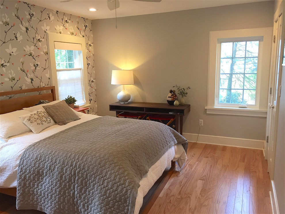 Design ideas for a medium sized traditional master bedroom in Newark with grey walls, medium hardwood flooring, no fireplace and brown floors.