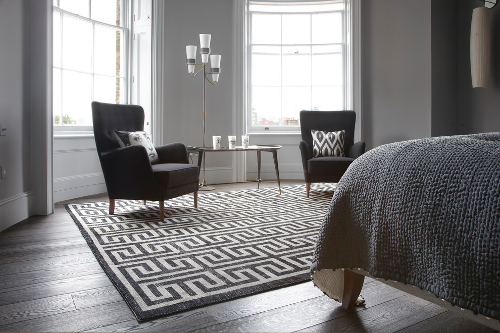 Inspiration for a large contemporary master medium tone wood floor bedroom remodel in London with gray walls and no fireplace