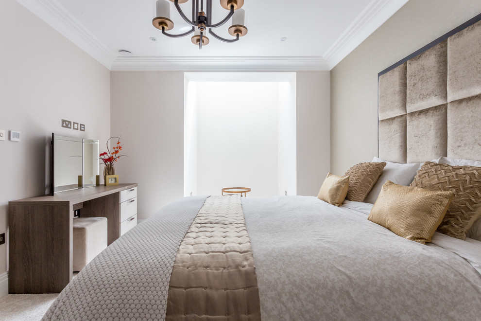 Example of a transitional bedroom design in Hertfordshire