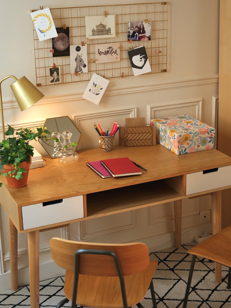 Study room - mid-sized scandinavian freestanding desk medium tone wood floor study room idea in Paris with white walls