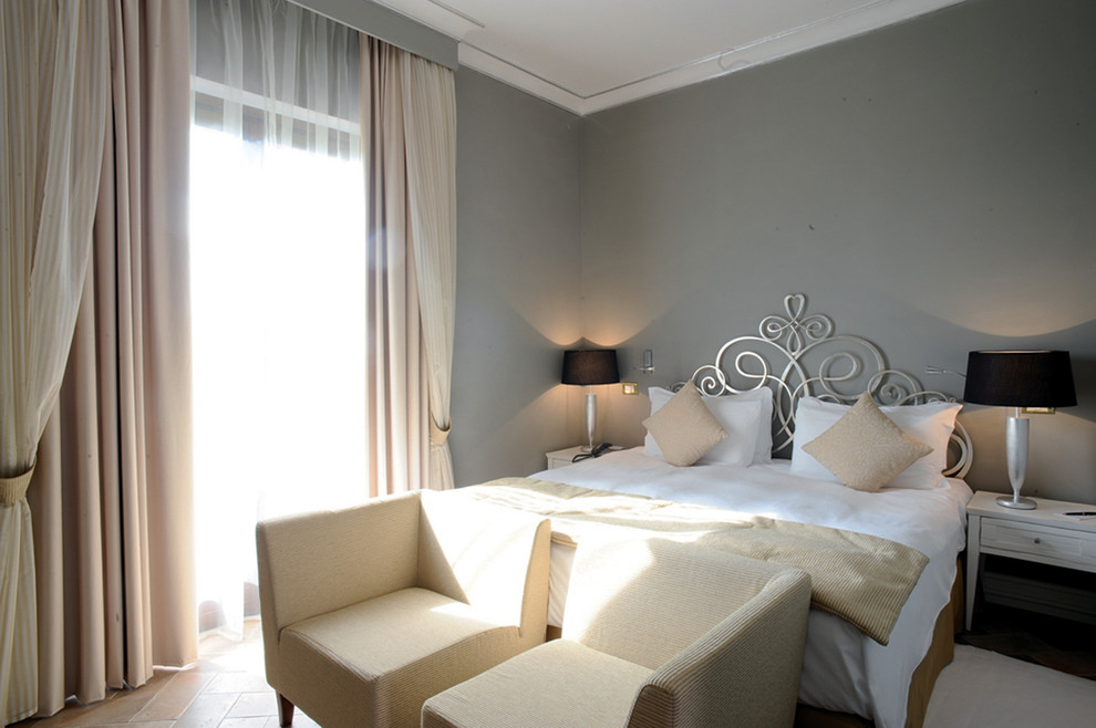 Design ideas for a classic master bedroom in Rome with grey walls.