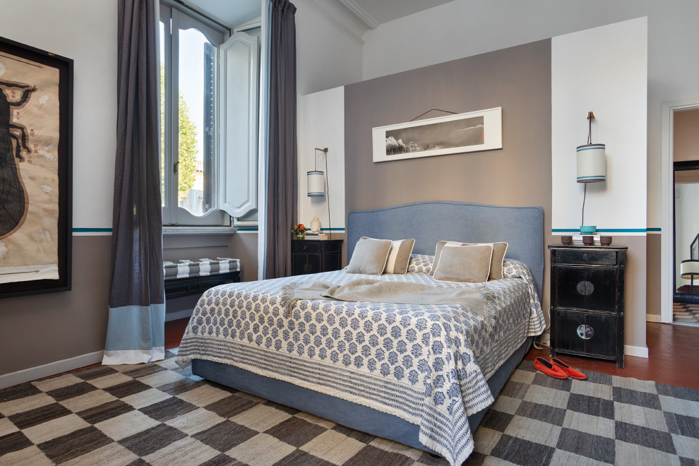 Contemporary master bedroom in Rome with white walls and red floors.