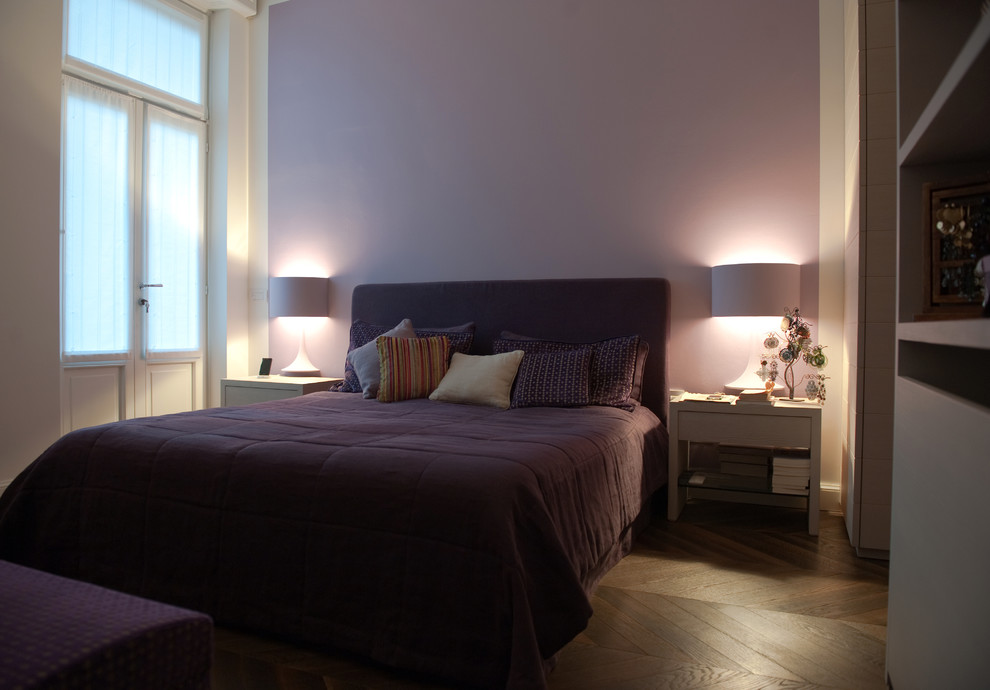 Large minimalist master dark wood floor and brown floor bedroom photo in Milan with purple walls and no fireplace