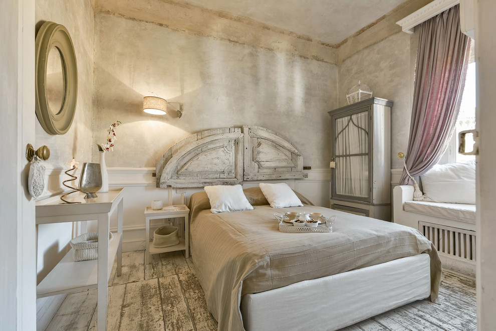 This is an example of a shabby-chic style bedroom in Florence.
