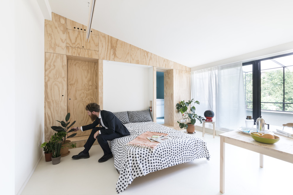 ミラノにある小さな北欧スタイルのおしゃれな寝室のインテリア