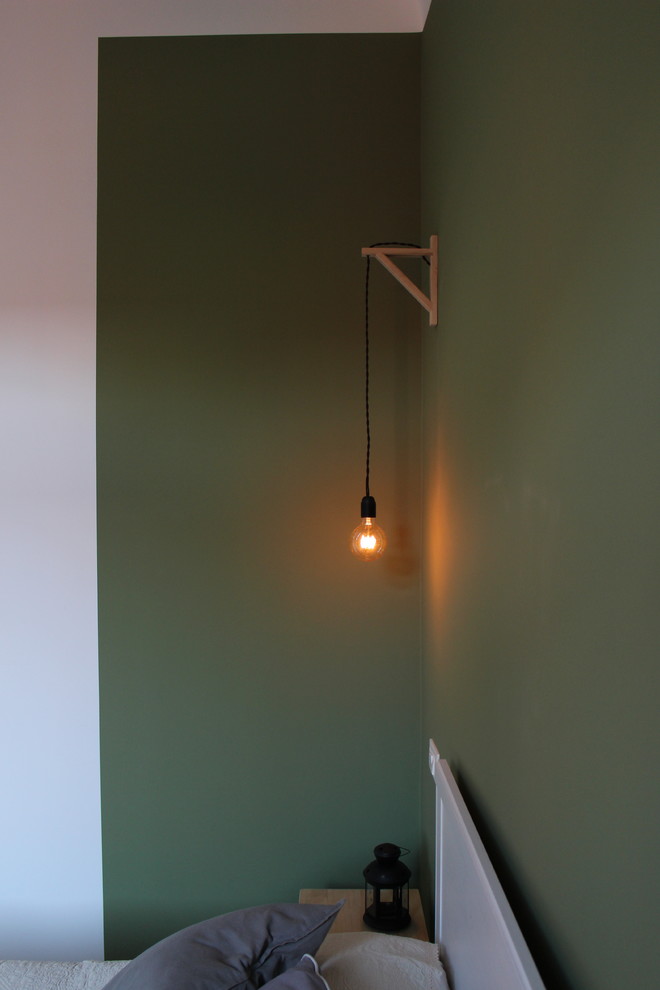 Bedroom - mid-sized scandinavian master laminate floor bedroom idea in Milan with green walls