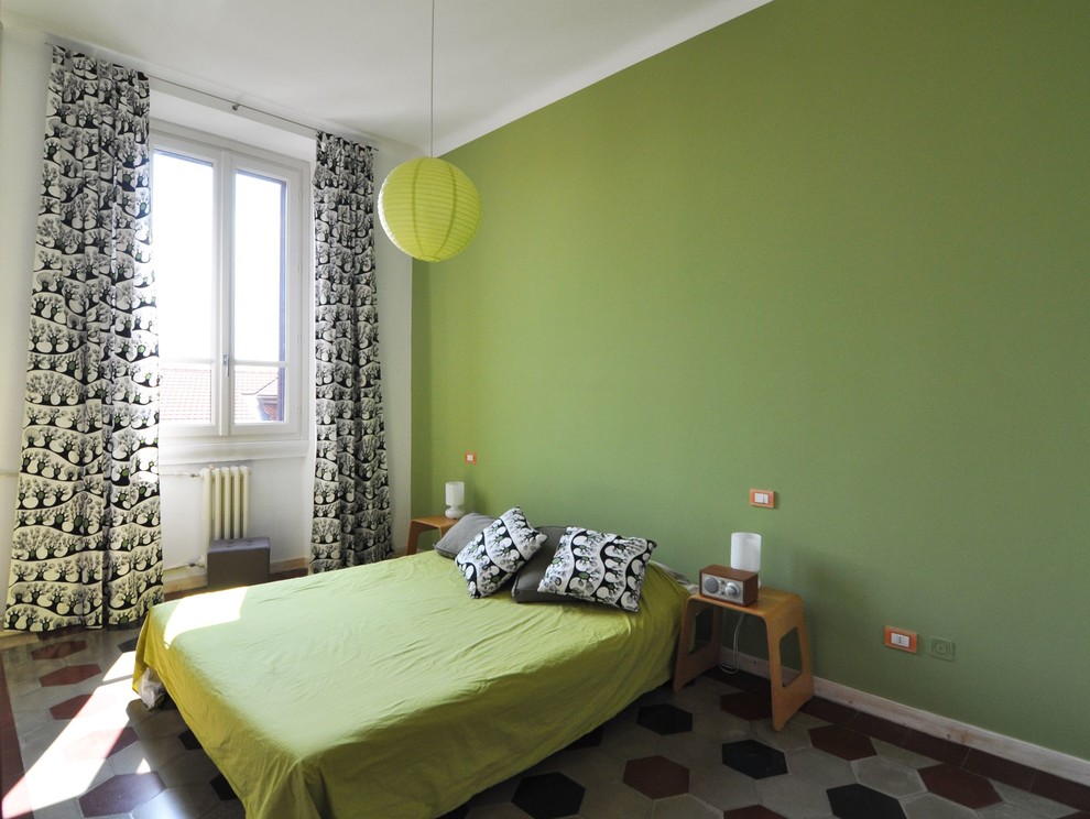 Example of a trendy guest bedroom design in Milan with green walls and no fireplace