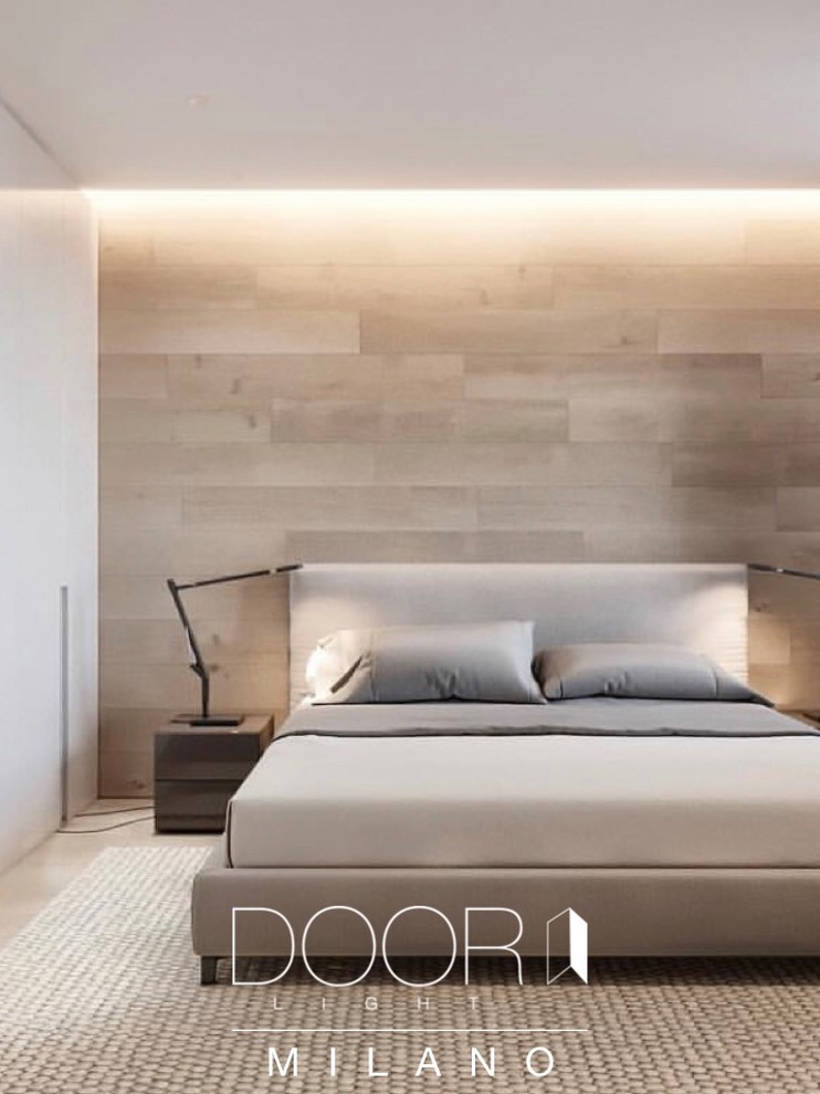 Small modern master bedroom with beige walls, cork flooring and beige floors.