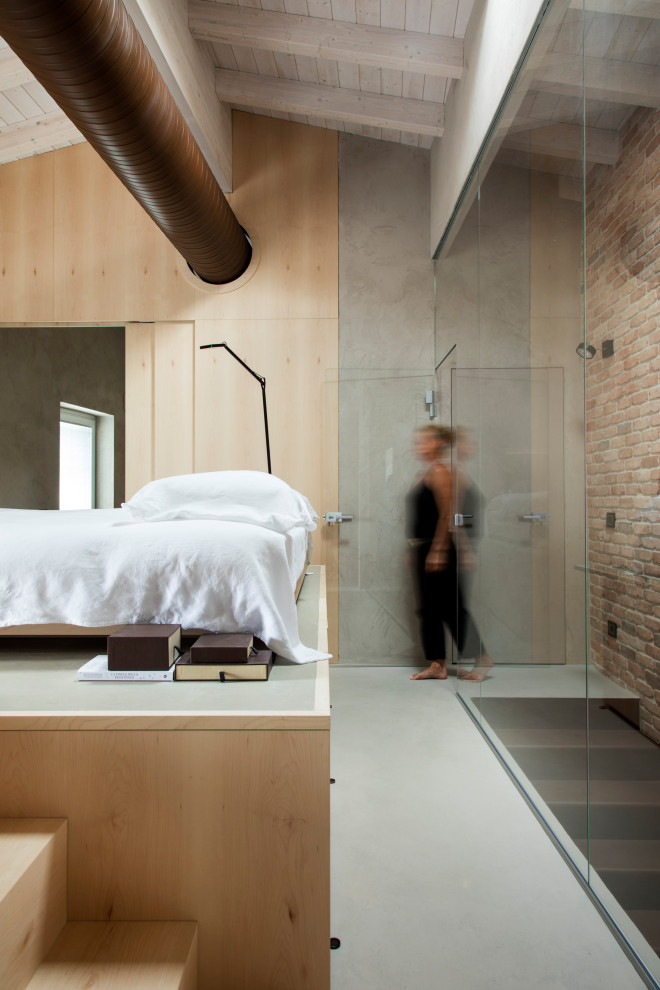 Example of a trendy gray floor bedroom design in Venice with gray walls