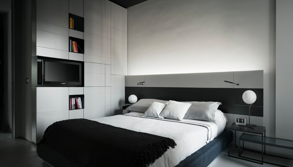 Photo of a contemporary master bedroom in Milan with white walls.